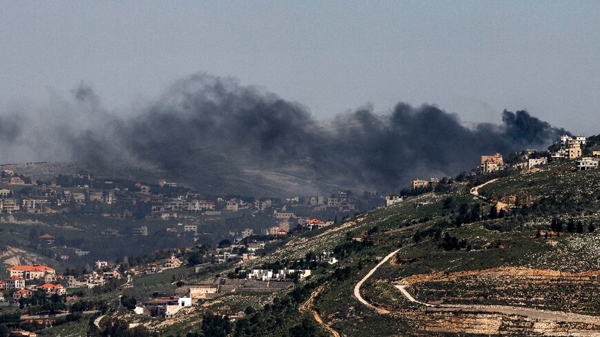 Smoke rises following Israeli bombardment on southern Lebanon near the border as seen from the Upper Galilee in northern Israel on March 18, 2026