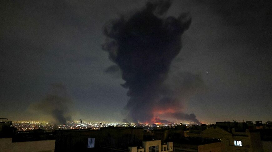 Smoke rises from Mehrabad International Airport in Tehran as the Mideast war enter its second week