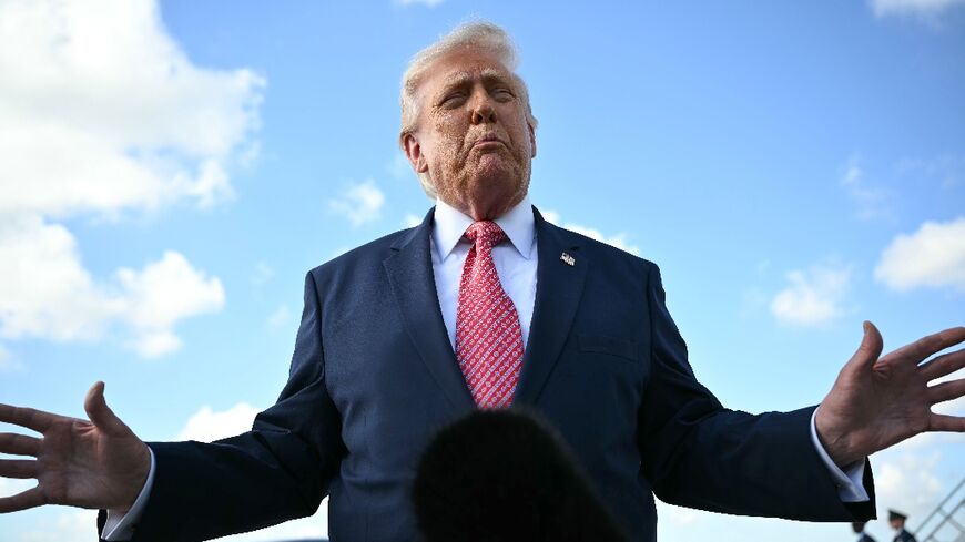 US President Donald Trump speaks to the press upon arrival at Miami International Airport in Miami