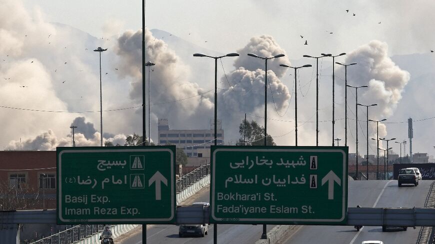 Smoke rises over Tehran on March 5