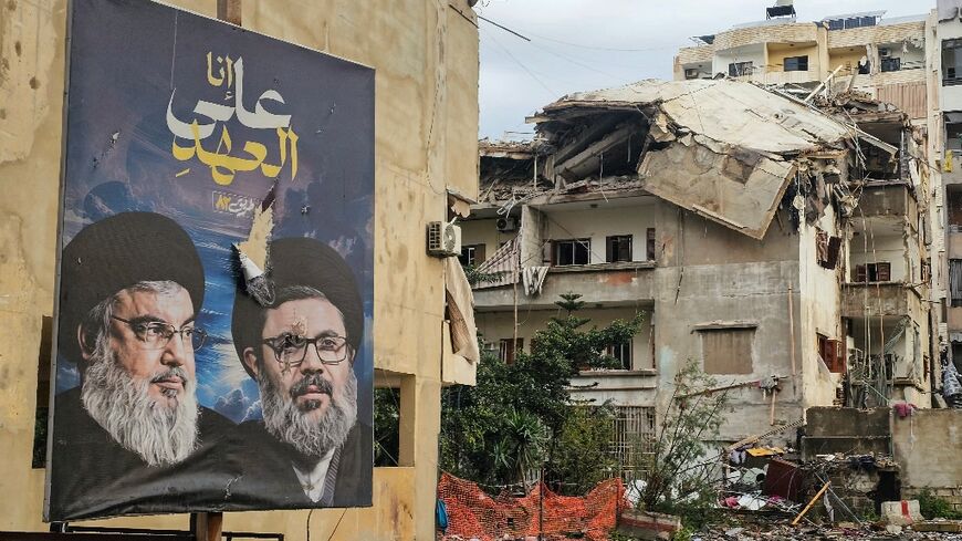 Banners bearing portraits the slain leaders of Lebanon's Hezbollah movement now look down on ruins left by the latest Israeli strikes