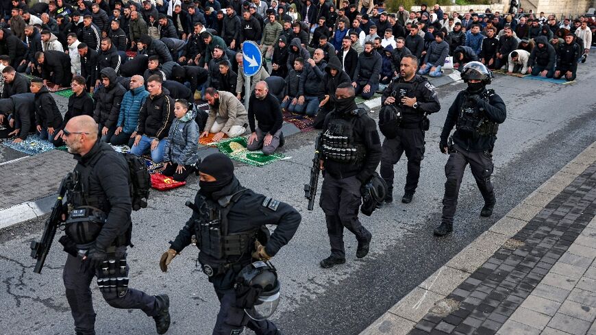 Muslim worshippers prayed at the walls of Jerusalem's Old City to mark the Eid al-Fitr holiday as access is shut for the Al-Aqsa Mosque