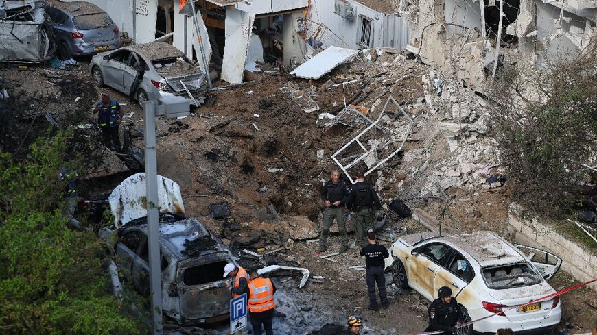 The site of an Iranian missile strike in Tel Aviv on March 24, 2026