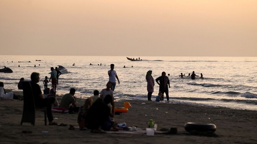 This photo, taken in 2021, shows Iranians on a beach in the Caspian Sea port city of Mahmoud Abad 