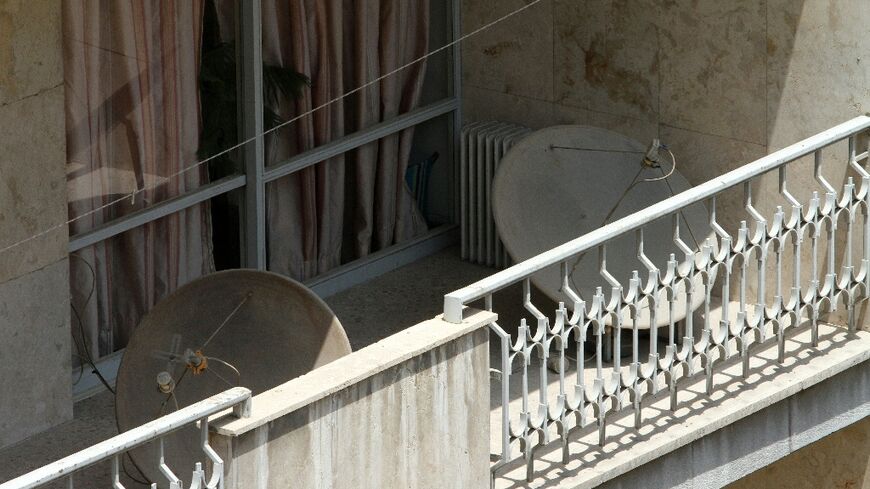 Satellite dishes on a balcony in Tehran. The authorities have often cracked down on their use
