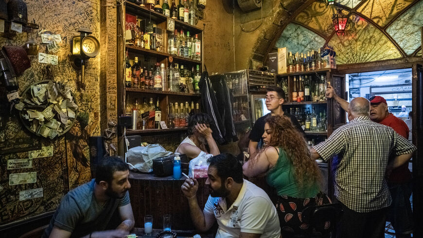 People drink and chat in a bar in the old town in Damascus on June 19, 2025 in Damascus, Syria. 