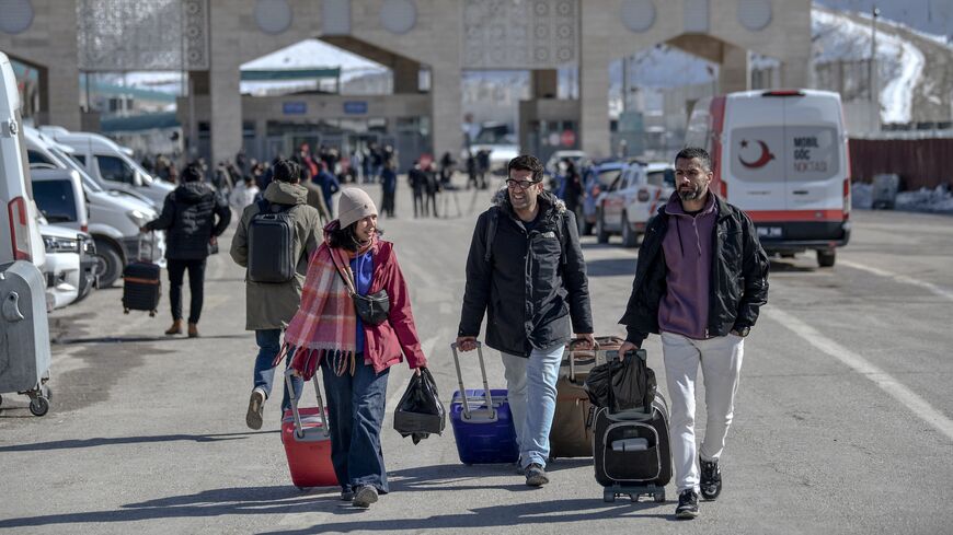 Iranian nationals arrive in Turkey after passing through the Razi-Kapikoy border crossing in Van, northeastern Turkey, on March 3, 2026.