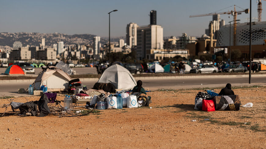 Displaced families set up tents along Beirut's waterfront in Beirut, Lebanon, on March 10, 2026, after fleeing recent Israel-Hezbollah hostilities.