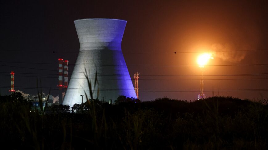 Excess gas is burned at the oil refinery in Israel's northern city of Haifa late on March 19, 2026.