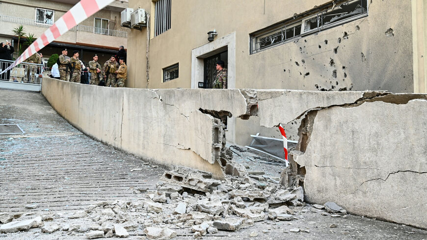Lebanese soldiers stand at the site where, according to Lebanese authorities, fragments from a missile interception fell in the town of Sahel Alma, north of Beirut, on March 24, 2026. Explosions rocked several areas north of Beirut that have so far been spared in the ongoing Israel-Hezbollah war, according to residents and local media, with a military official saying the blasts likely came from an intercepted Iranian missile. (Photo by FADEL itani / AFP via Getty Images)