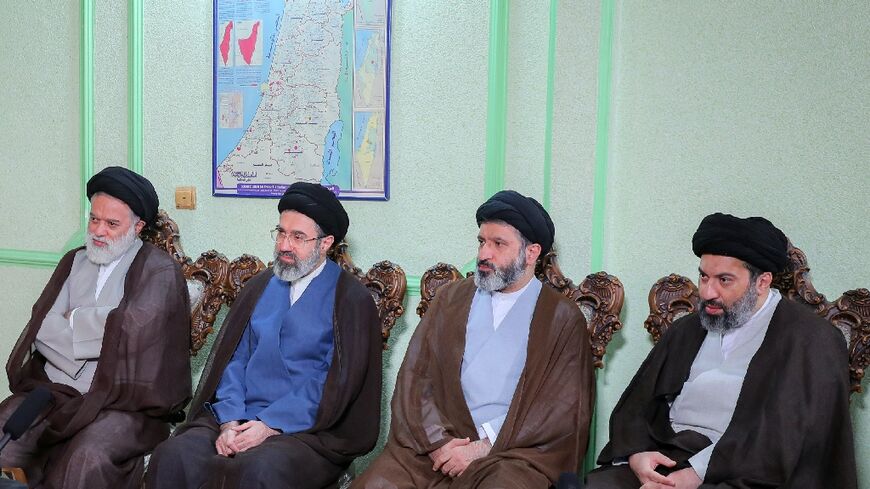 Mojtaba Khamenei is seen here, second on the left, in a photo issued by the office of the supreme leader in 2024 