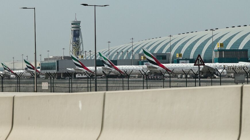 Emirates airline planes are parked on the tarmac at Dubai International Airport on March 2