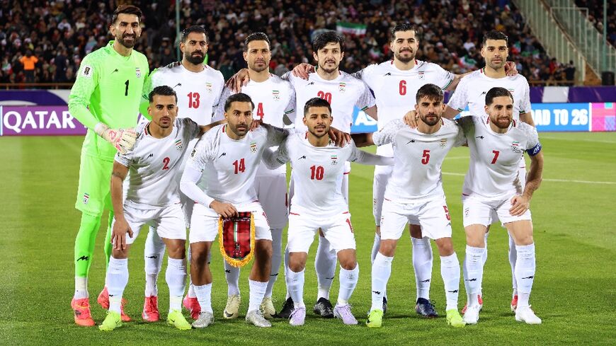 The Iran team poses for a photo before a World Cup qualifier against Uzbekistan in Tehran in March last year