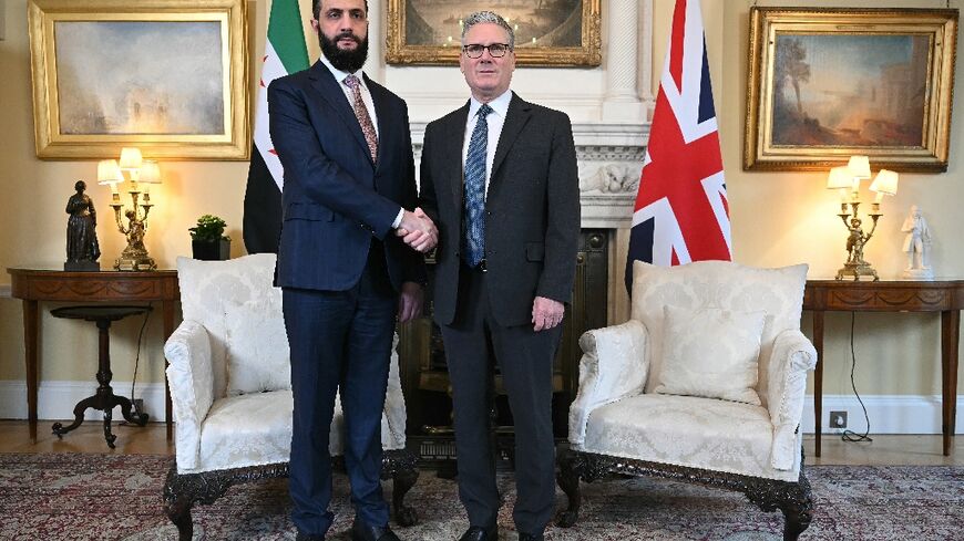 Syria's President Ahmed al-Sharaa is welcomed by Britain's Prime Minister Keir Starmer for talks at 10 Downing Street in central London