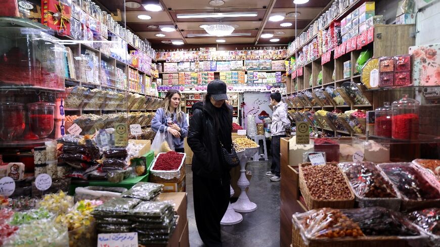 Despite the airstrikes, Tehran residents shop for groceries on Saturday