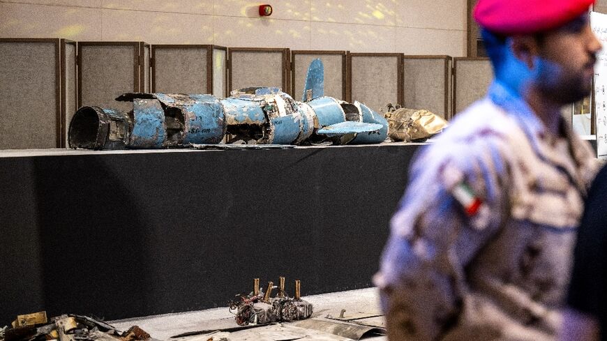 Pieces of missiles and drones recovered after Iran’s strikes are displayed during a press briefing by the UAE government
