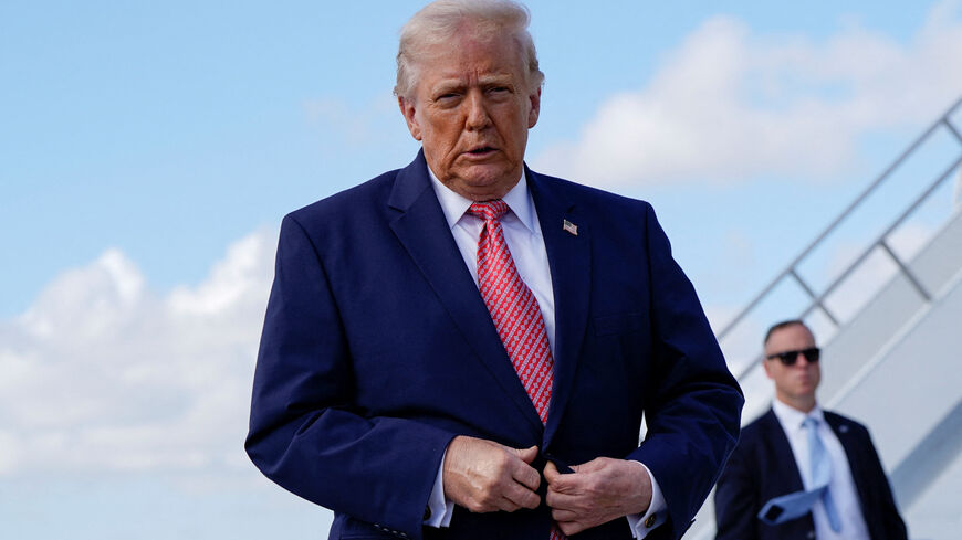 U.S. President Donald Trump walks to speak to reporters as he arrives at Miami International Airport in Miami, Florida, U.S., March 27, 2026. REUTERS/Elizabeth Frantz