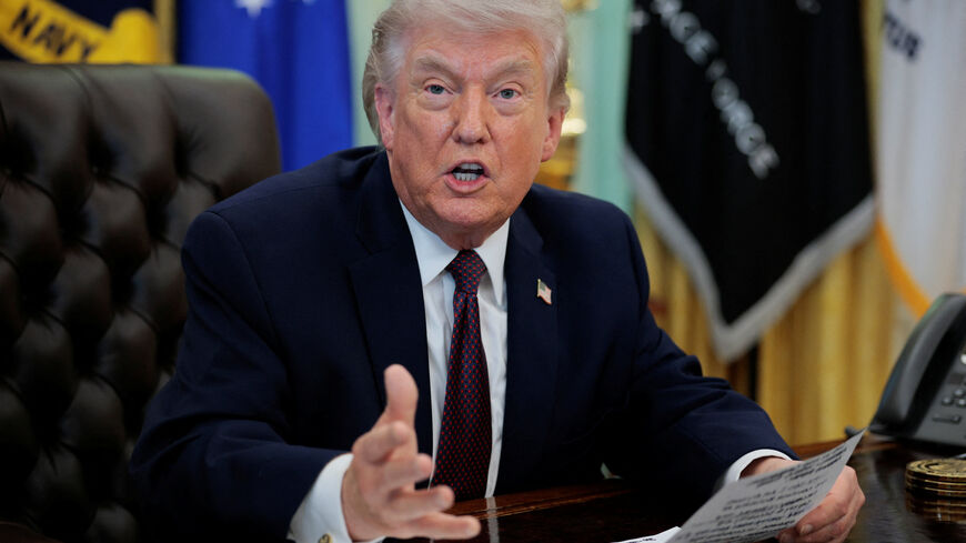 U.S. President Donald Trump speaks during the signing ceremony for an execituve order on mail ballots, in the Oval Office of the White House in Washington, D.C., March 31, 2026.  REUTERS/Evan Vucci