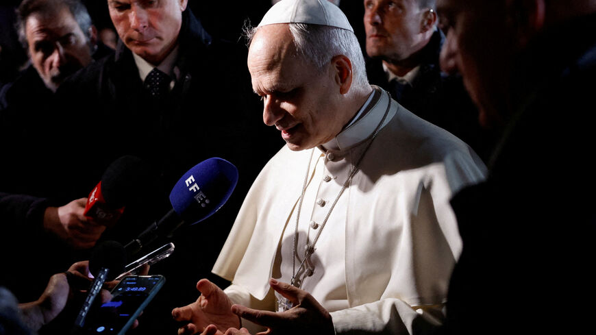 FILE PHOTO: Pope Leo XIV speaks to the media as he leaves the papal residence to head back to the Vatican, in Castel Gandolfo, Italy, March 31, 2026. REUTERS/Remo Casilli/File Photo