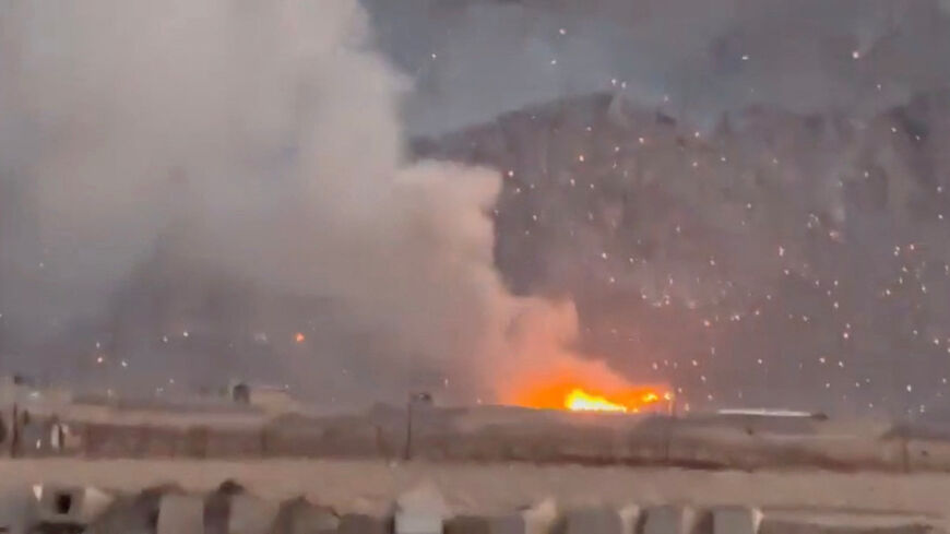 Smoke rises following a reported strike, as burning debris litters the surrounding area, amid the U.S.-Israeli conflict with Iran, in Baharestan, Isfahan province, Iran in this screengrab taken from a social media video released on April 1, 2026. SOCIAL MEDIA/via REUTERS/File Photo