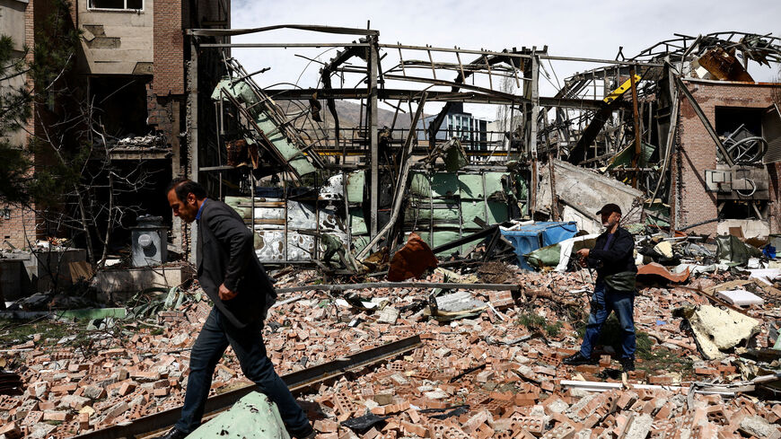 People inspect the damage at the research building of the Shahid Beheshti University, which was damaged by a strike, amid the U.S.-Israeli conflict with Iran, in Tehran, Iran, April 4, 2026. Majid Asgaripour/WANA (West Asia News Agency) via REUTERS