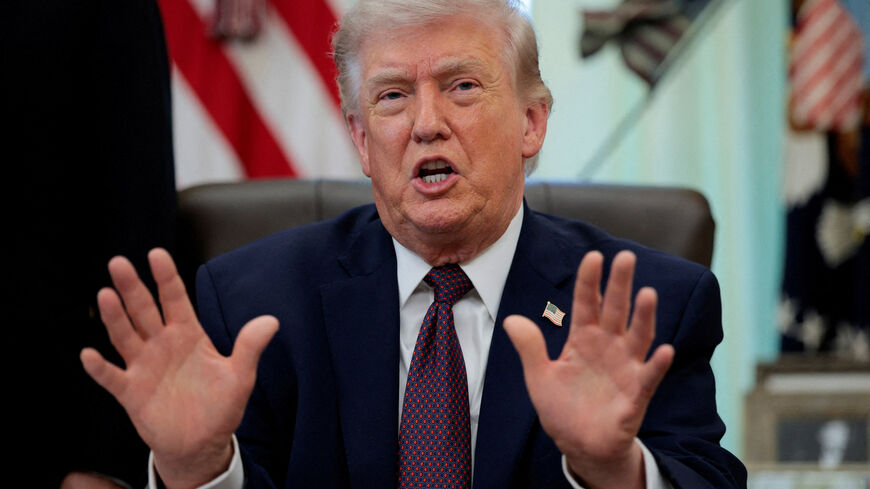 FILE PHOTO: U.S. President Donald Trump speaks during the signing ceremony for an executive order on mail ballots, in the Oval Office of the White House in Washington, D.C., March 31, 2026.  REUTERS/Evan Vucci/File Photo