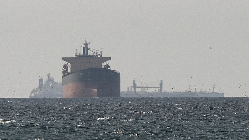 FILE PHOTO: Cargo ships in the Gulf, near the Strait of Hormuz, as seen from northern Ras al-Khaimah, near the border with Oman’s Musandam governance, amid the U.S.-Israeli conflict with Iran, in United Arab Emirates, March 11, 2026. REUTERS/Stringer/File Photo