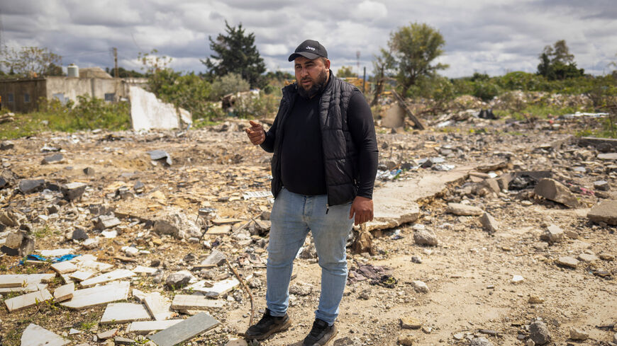 Hussein Saleh, 34, stands on the rubble of his house destroyed in an Israeli airstrike, which killed members of his family, amid escalating hostilities between Israel and Hezbollah, as the U.S.-Israeli conflict with Iran continues, in Tyre, Lebanon, April 7, 2026. REUTERS/Adnan Abidi