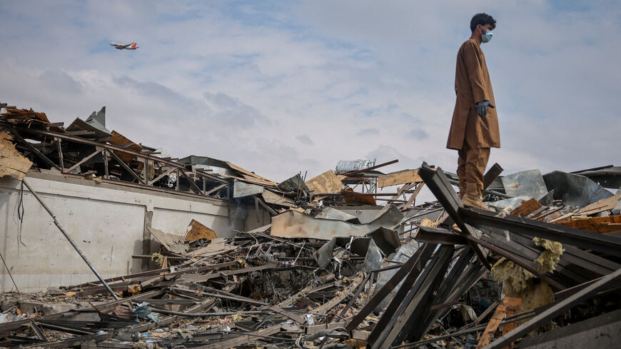 A man stands on the debris at the site of a drug rehabilitation hospital destroyed in what the Taliban said was a Pakistani air strike in Kabul, Afghanistan, March 17, 2026. REUTERS/Sayed Hassib