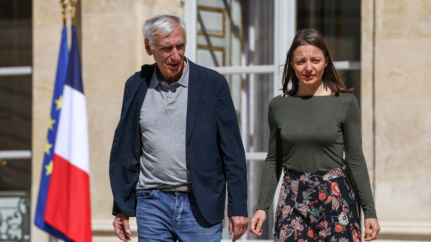 Jacques Paris and Cecile Kohler, French nationals who were freed by Iran after three and a half years in detention, walk at the Elysee Palace as they are hosted by French President Emmanuel Macron, in Paris, France, April 8, 2026. REUTERS/Tom Nicholson/Pool