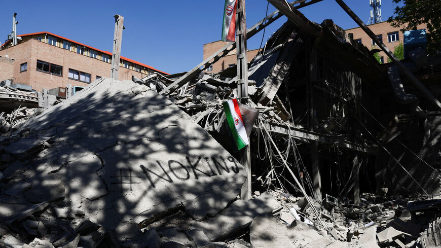 FILE PHOTO: An Iranian flag hangs amidst the rubble of a building of the Sharif University of Technology, which was damaged in a strike, amid the U.S.-Israeli conflict with Iran, in Tehran, Iran, April 7, 2026. Majid Asgaripour/WANA (West Asia News Agency) via REUTERS