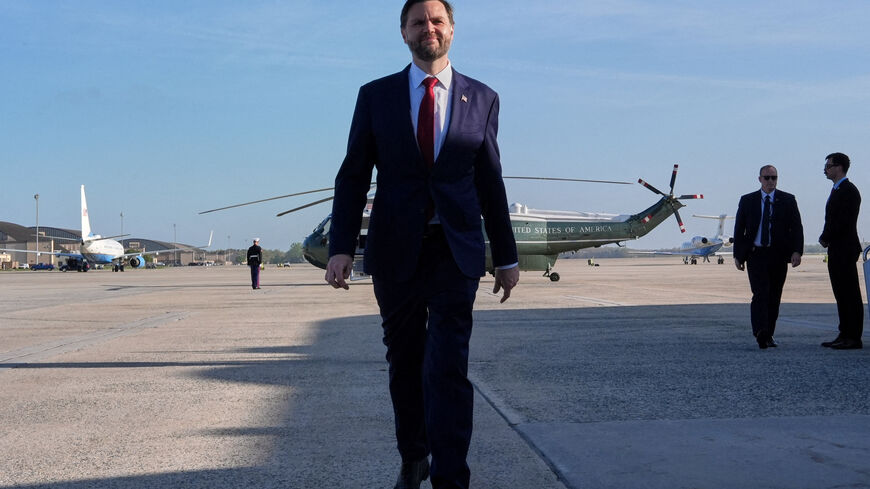 FILE PHOTO: U.S. Vice President JD Vance walks to speak to the media before boarding Air Force Two for expected departure to Pakistan for talks on Iran, at Joint Base Andrews, Maryland, U.S., April 10, 2026. Jacquelyn Martin/Pool via REUTERS/File Photo
