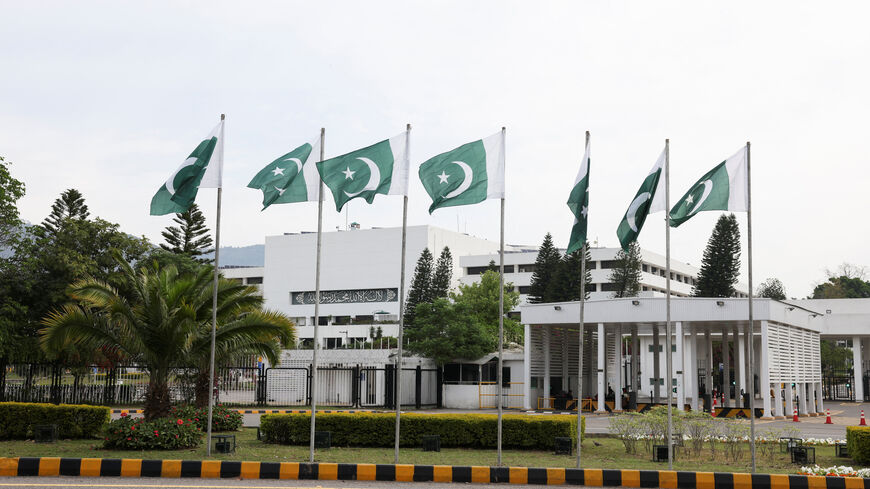 Pakistani flags flutter near the Parliament House, as delegations from the United States and Iran are expected to hold high-stakes talks, in Islamabad, Pakistan, April 11, 2026. REUTERS/Akhtar Soomro