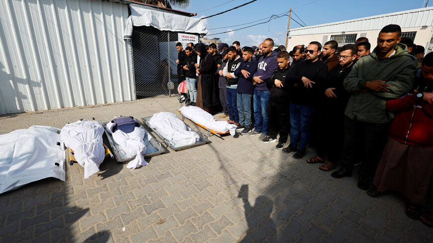 Mourners pray during the funeral of Palestinians who were killed in an Israeli strike, according to medics, at Al-Aqsa Martyrs Hospital in Deir al-Balah, central Gaza Strip, April 11, 2026. REUTERS/Mahmoud Issa