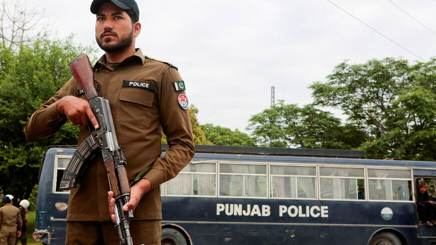 A police officer stands guard on a road leading to Serena Hotel as delegations from the United States and Iran are expected to hold peace talks in Islamabad, Pakistan, April 11, 2026. REUTERS/Asim Hafeez