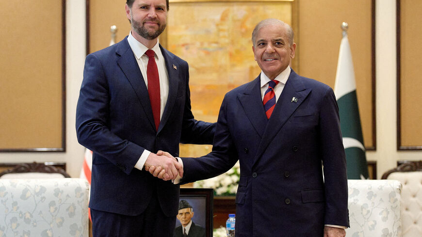 U.S. Vice President JD Vance and Pakistan's Prime Minister Shehbaz Sharif pose on the day of a meeting for talks about Iran, in Islamabad, Pakistan, April 11, 2026.    Jacquelyn Martin/Pool via REUTERS