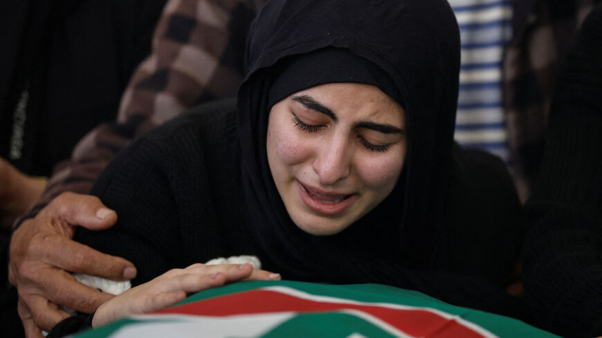 A young woman mourns over the body of her sister Hawraa, 22,  during the funeral service of six women and a man killed in Israeli strikes yesterday in Abbasiyeh, at a mosque in Tyre, Lebanon, April 10, 2026. REUTERS/Louisa Gouliamaki