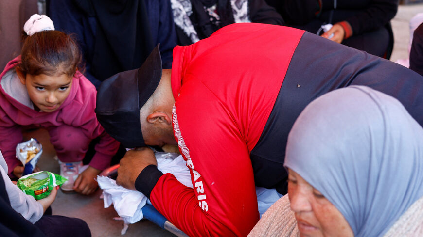 A mourner reacts during the funeral of a Palestinian who was killed in an Israeli strike, according to medics, at Al-Aqsa Martyrs Hospital in Deir al-Balah, central Gaza Strip, April 13, 2026. REUTERS/Mahmoud Issa