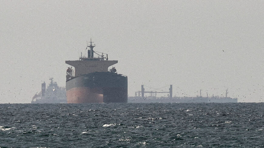 FILE PHOTO: Cargo ships in the Gulf, near the Strait of Hormuz, as seen from northern Ras al-Khaimah, near the border with Oman’s Musandam governance, amid the U.S.-Israeli conflict with Iran, in United Arab Emirates, March 11, 2026. REUTERS/Stringer/File Photo