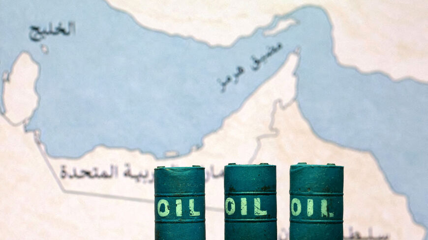 A map showing the Strait of Hormuz, also known as Madiq Hurmuz, and 3D printed oil barrels are seen in this illustration taken March 26, 2026. REUTERS/Dado Ruvic/Illustration
