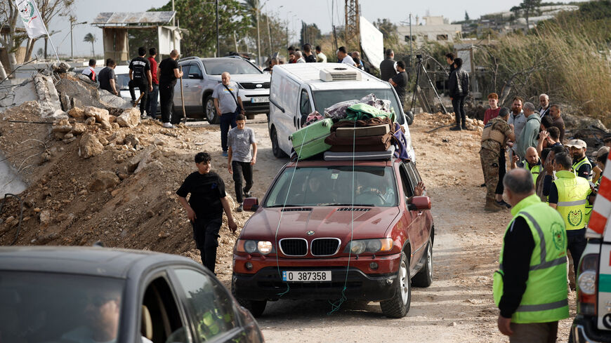 Displaced people make their way back to their homes as they cross the bridge linking southern Lebanon to the rest of the country, which was hit earlier in an Israeli strike, after a 10-day ceasefire between Lebanon and Israel went into effect, in Qasmiyeh, Lebanon, April 17, 2026. REUTERS/Louisa Gouliamaki