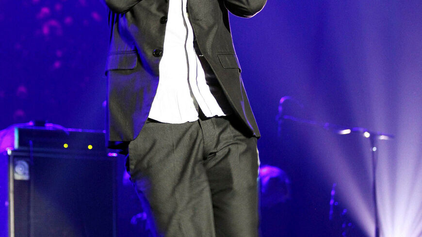 FILE PHOTO: Tunisian actor and playwright Lotfi Abdelli performs on stage in Tunis on November 11, 2011.  REUTERS/Zoubeir Souissi/File Photo