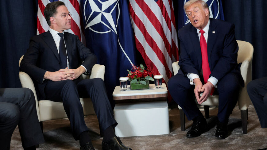 FILE PHOTO: U.S. President Donald Trump holds a bilateral meeting with NATO Secretary General Mark Rutte at the World Economic Forum (WEF) in Davos, Switzerland, January 21, 2026. REUTERS/Jonathan Ernst/File Photo