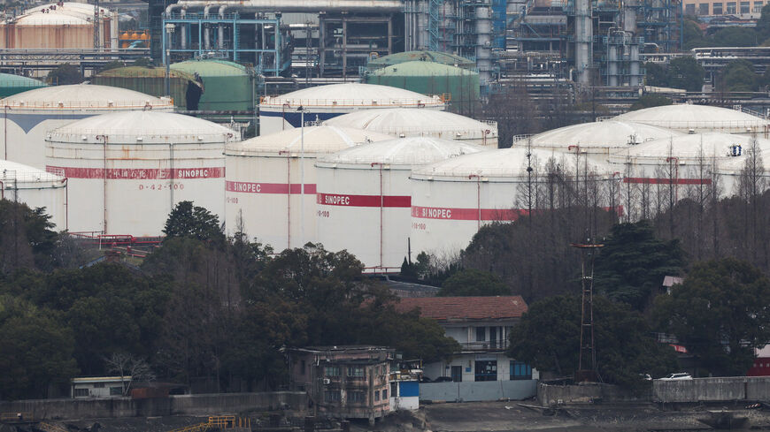 FILE PHOTO: Oil storage tanks and facilities of a Sinopec plant in Shanghai, China, March 26, 2026.  REUTERS/Go Nakamura/File Photo
