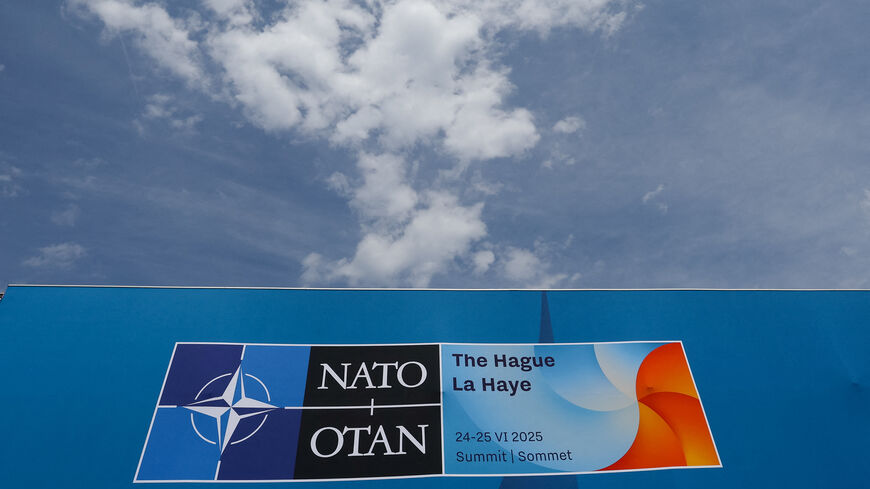 FILE PHOTO: A NATO sign is displayed ahead of a NATO leaders' summit in The Hague, Netherlands, June 22, 2025. REUTERS/Yves Herman/File Photo