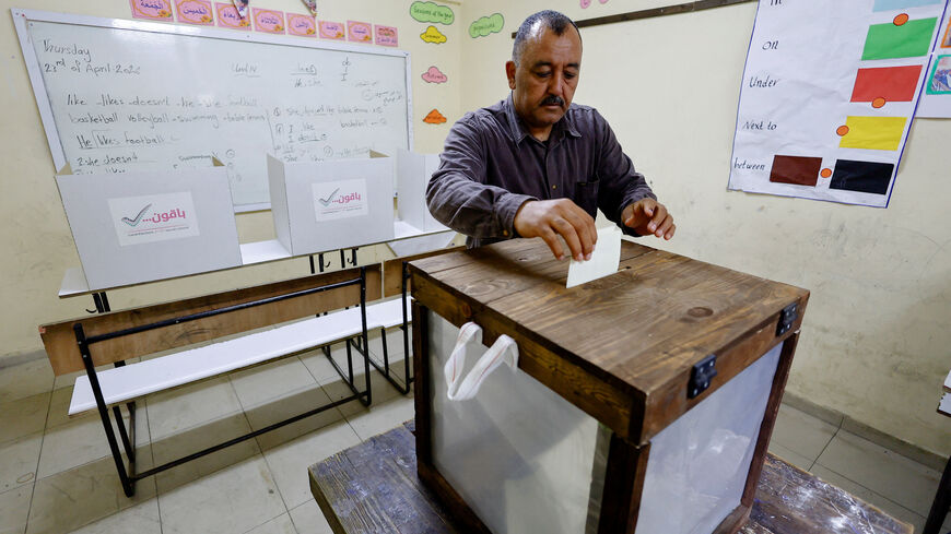 A Palestinian man votes during the municipal election at a polling station in Deir al-Balah, central Gaza Strip April 25, 2026. REUTERS/Mahmoud Issa