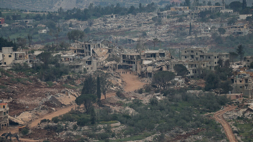 Israeli soldiers walk amid destroyed buildings in Lebanon, as seen from the Israeli side of the Israel-Lebanon border, in northern Israel, April 26, 2026. REUTERS/Shir Torem      TPX IMAGES OF THE DAY
