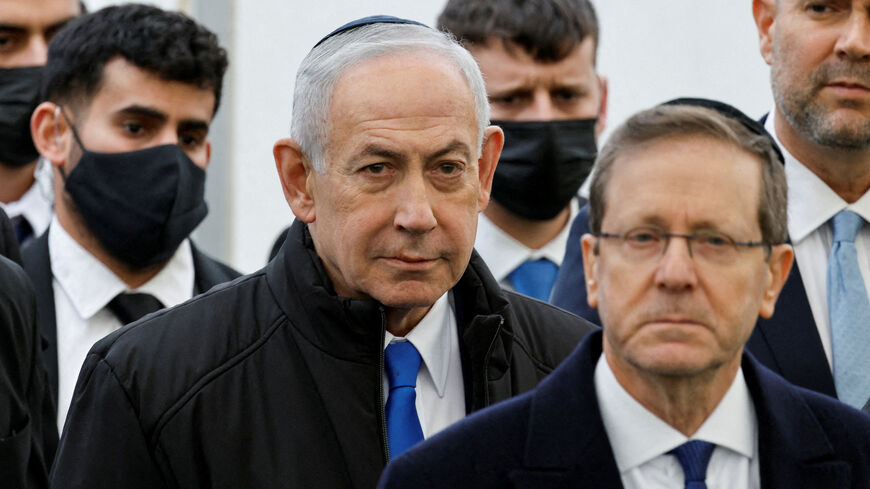 FILE PHOTO: Israeli Prime Minister Benjamin Netanyahu and Israeli President Isaac Herzog attend a memorial service, in Meitar, Israel, January 28, 2026. REUTERS/Amir Cohen/File Photo