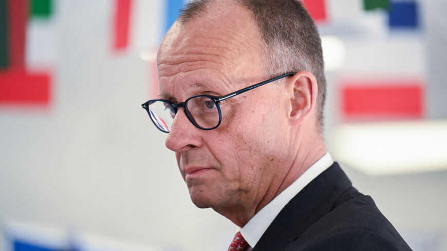 German Chancellor Friedrich Merz listens to students presenting their projects during his visit to the Carolus-Magnus-Gymnasium, as part of the EU Project Day in Schools, in Marsberg, Germany, April 27, 2026. REUTERS/Teresa Kroeger