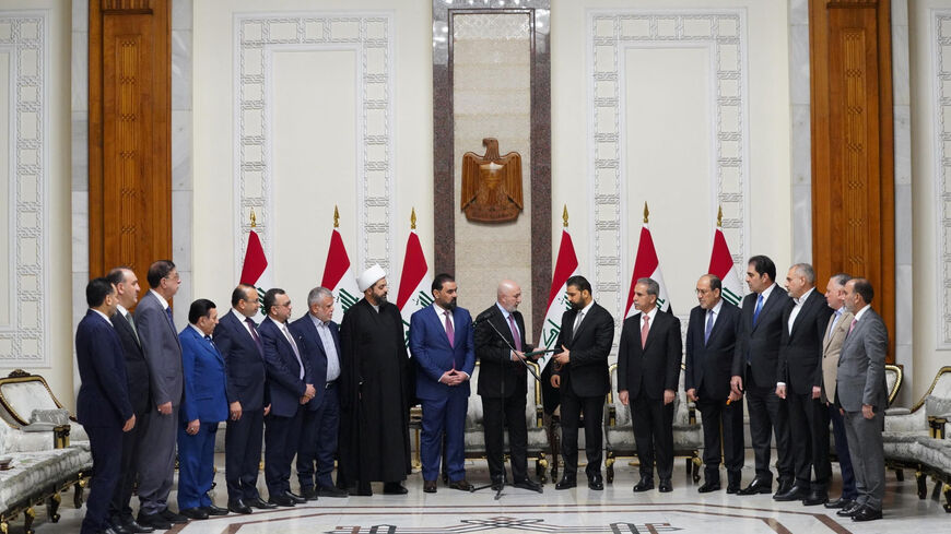 Iraqi President Nizar Amedi and Ali al-Zaidi, the nominee of Iraq's Shiite Coordination Framework for prime minister, stand with political figures during a ceremony where Zaidi was tasked with forming a new government, in Baghdad, Iraq, April 27, 2026. Iraqi President Media Office/Handout via REUTERS ATTENTION EDITORS – THIS IMAGE HAS BEEN SUPPLIED BY A THIRD PARTY